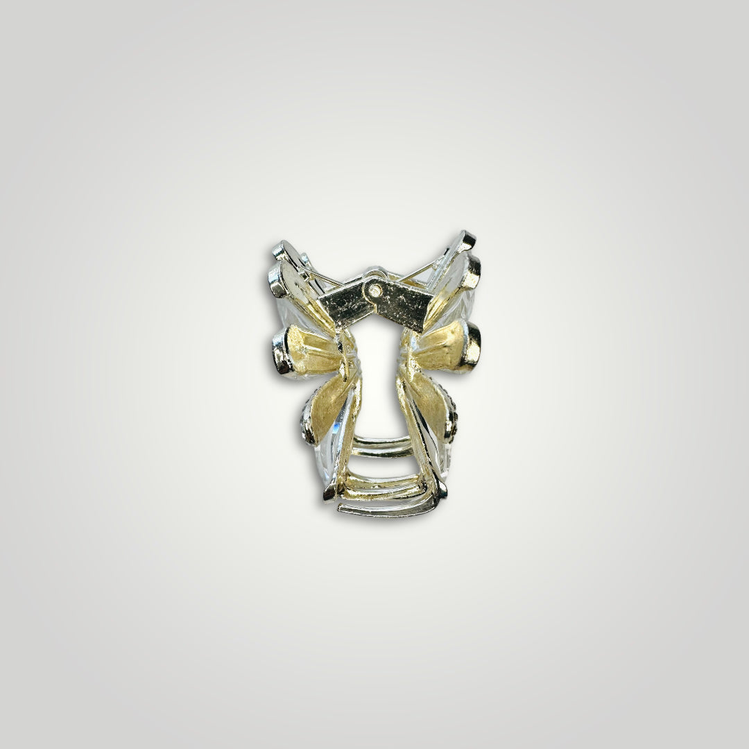 A golden metallic flower claw clip with crystal petals.