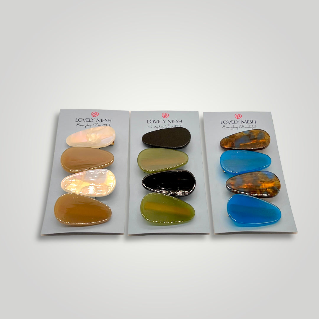 4 drop-shaped small clips, colors: Electric Blue and Brown with Blue.