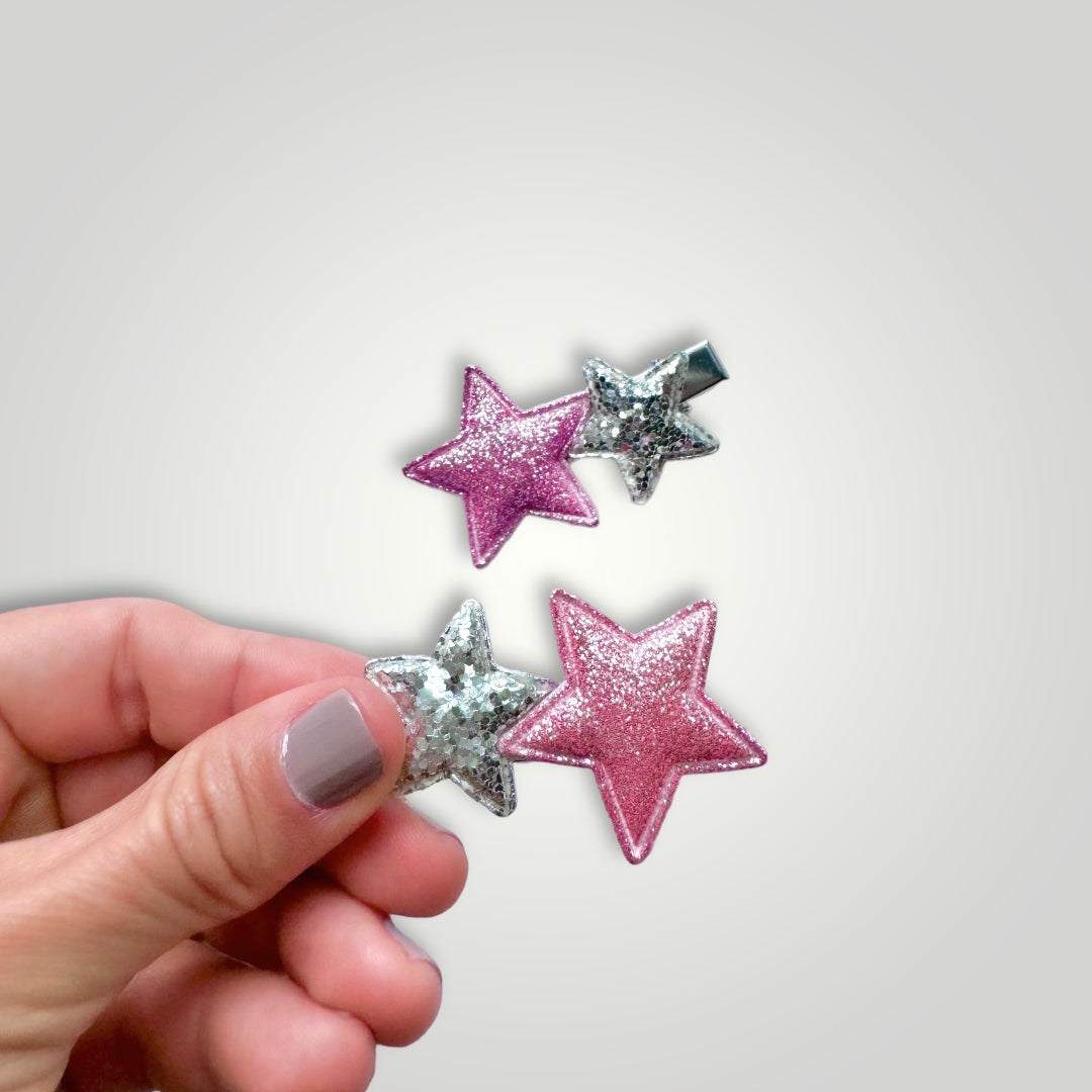 Pair of glittery starts with clip, colors: Silver and Pink.