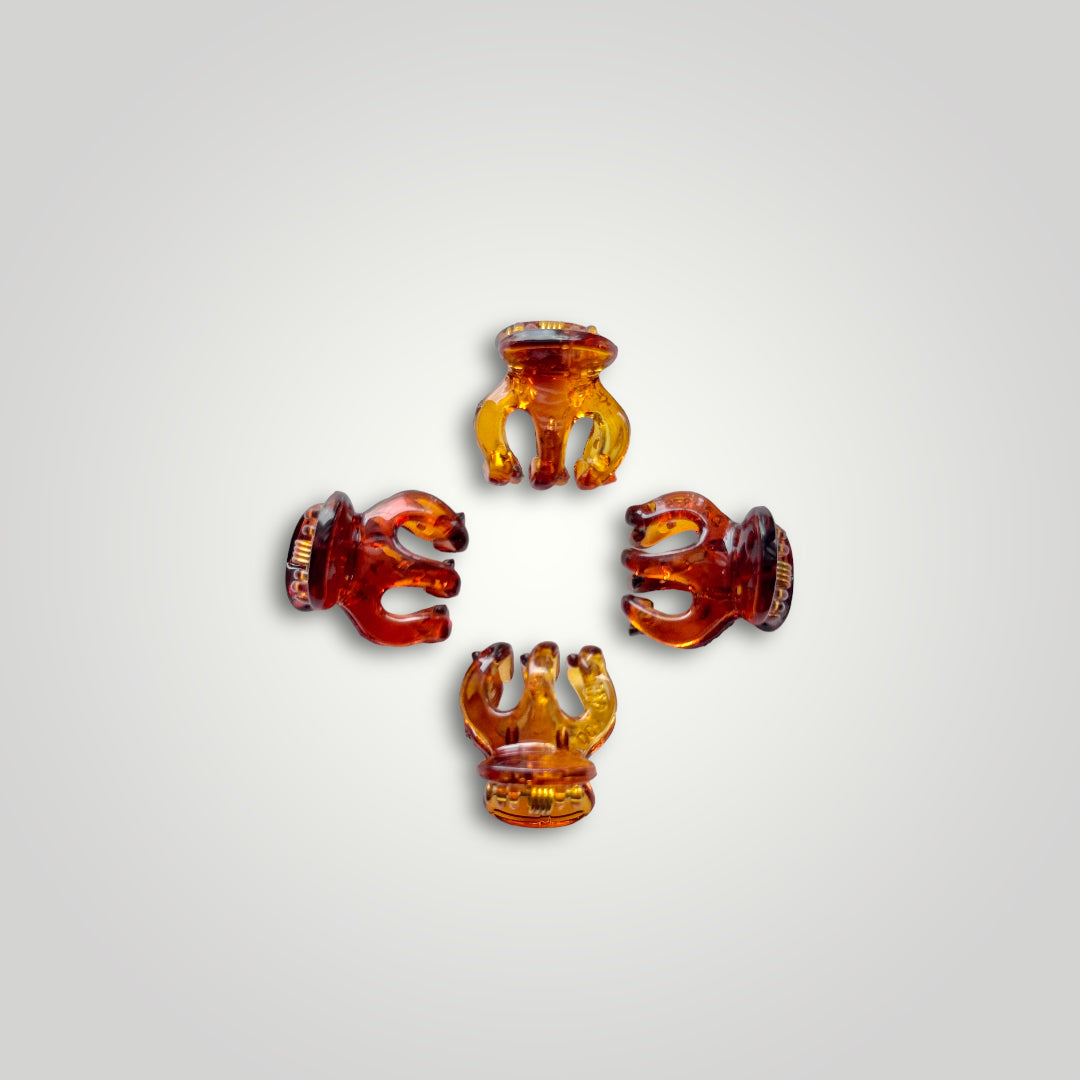 4 units of mini claw clips in retro. Colors: Amber and Dark Amber.