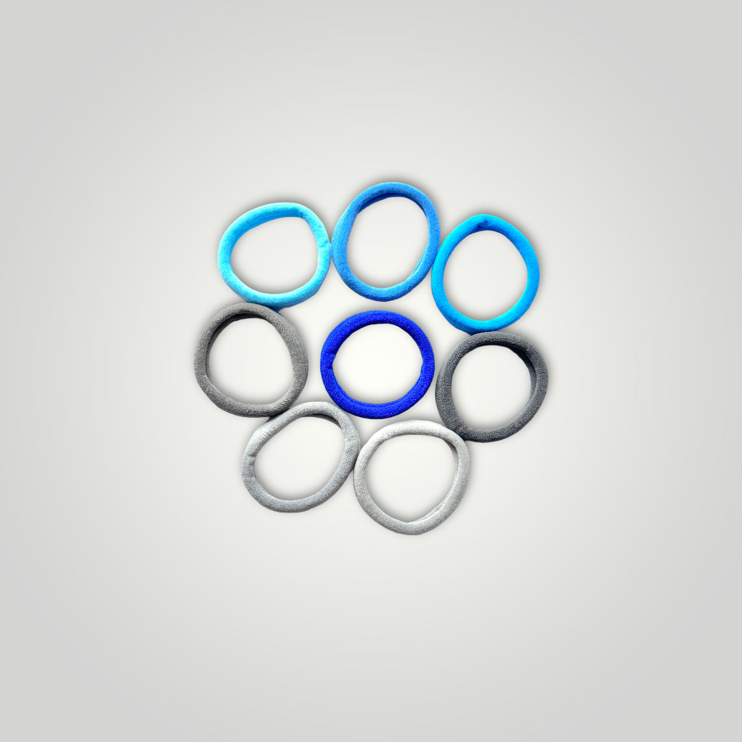 8 units of soft hair ties, 5cm diameter. Colors: Gray to Blue.