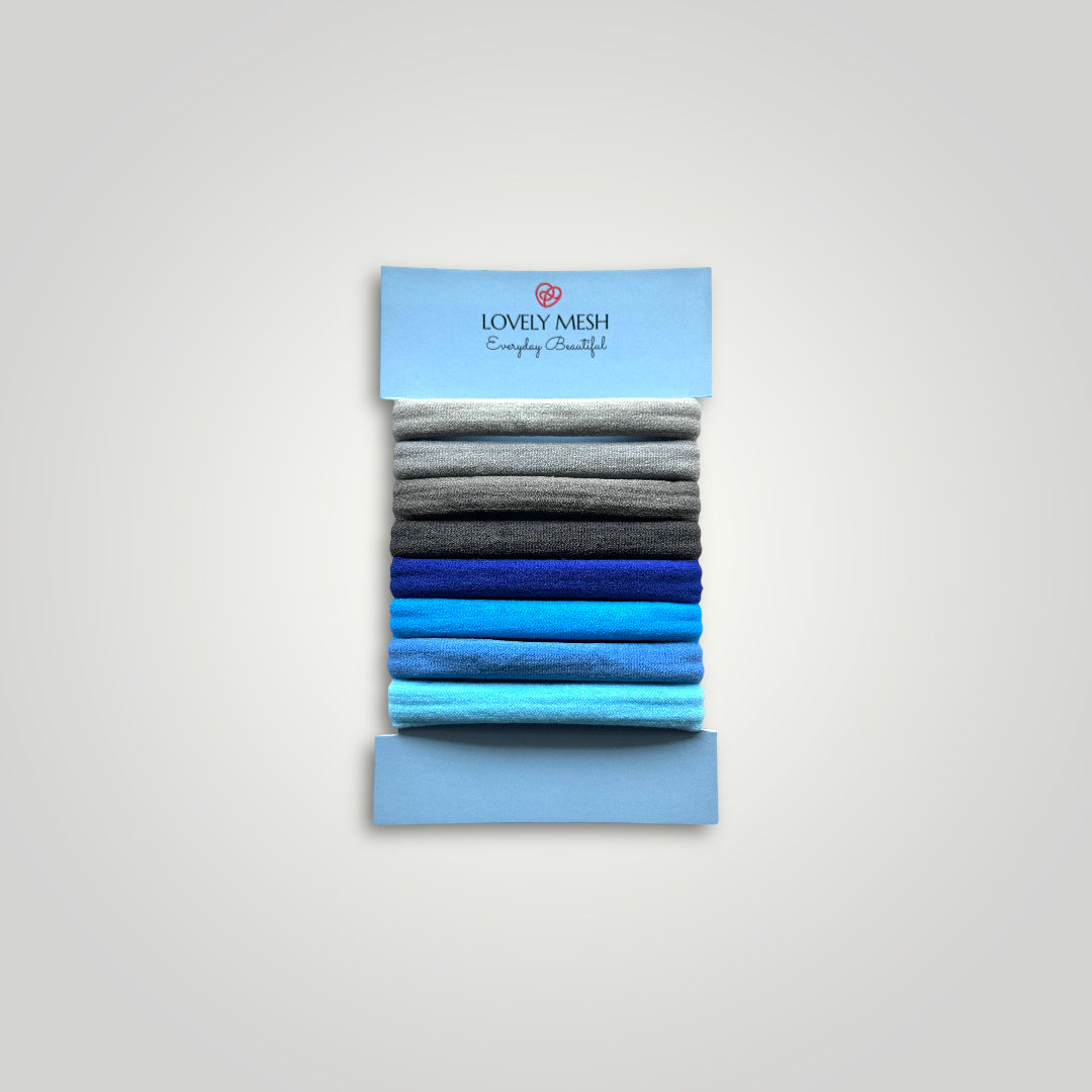 8 units of soft hair ties, 5cm diameter. Colors: Gray to Blue.