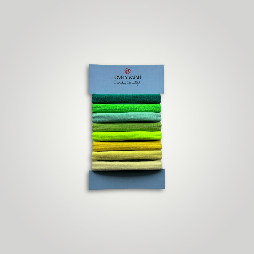 8 units of soft hair ties, 5cm diameter. Colors: Green to Yellow.